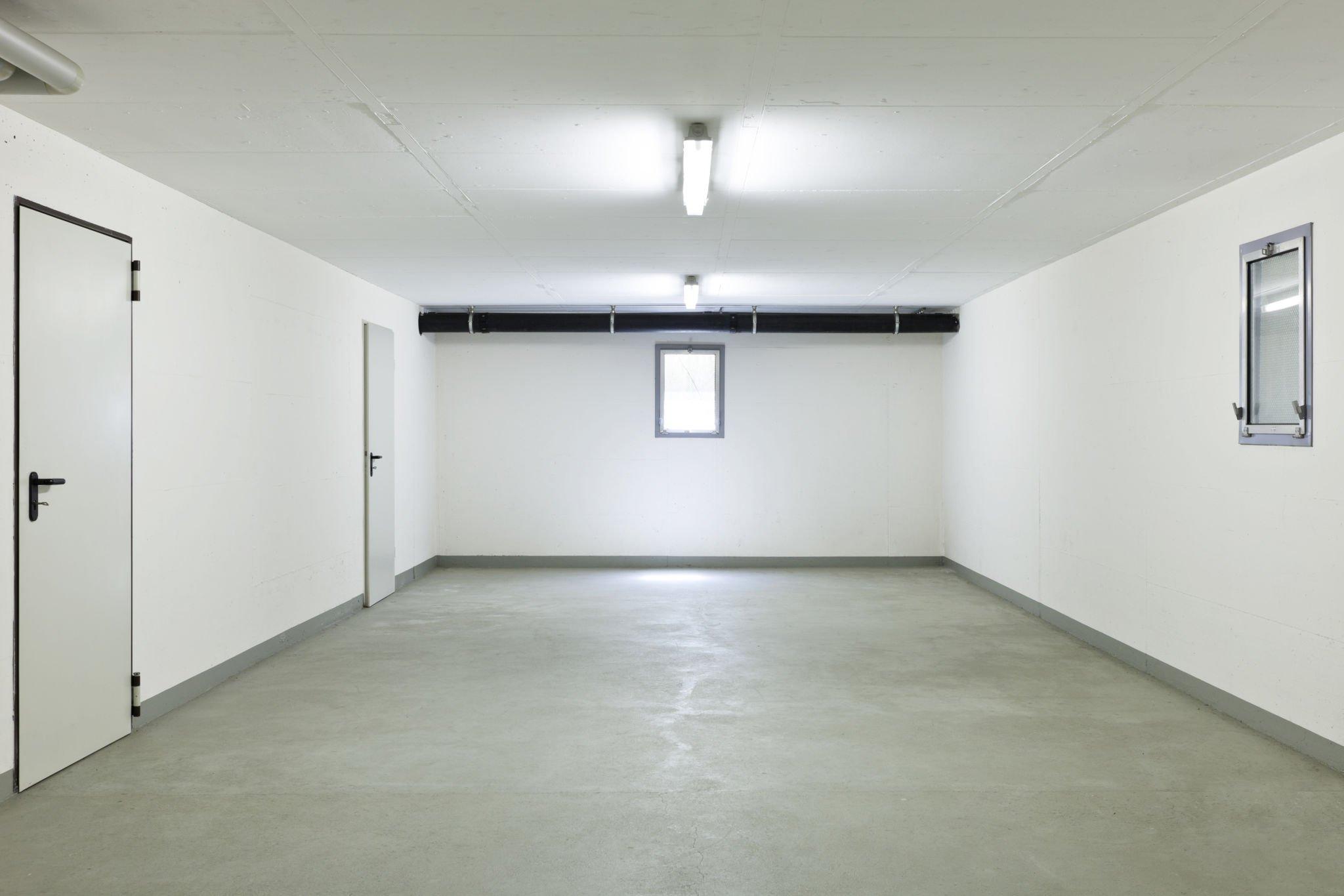 Empty white basement; barndominium with basement